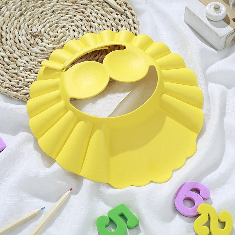 ShampooShower Bouclier de tête pour douche bébé.