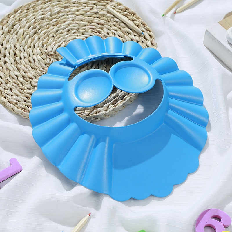 ShampooShower Bouclier de tête pour douche bébé.