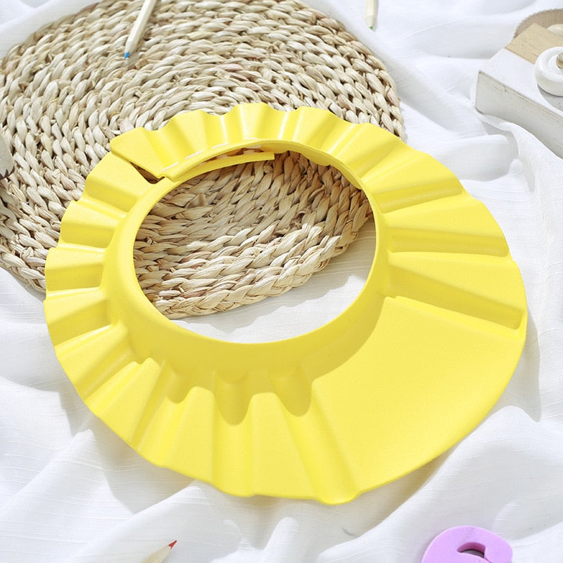 ShampooShower Bouclier de tête pour douche bébé.