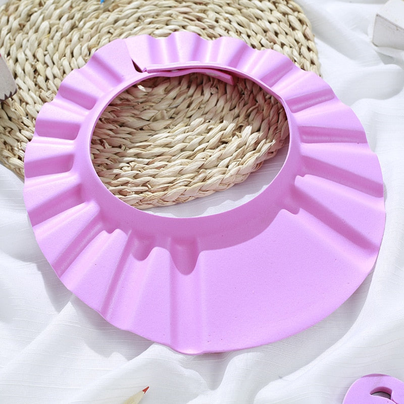 ShampooShower Bouclier de tête pour douche bébé.